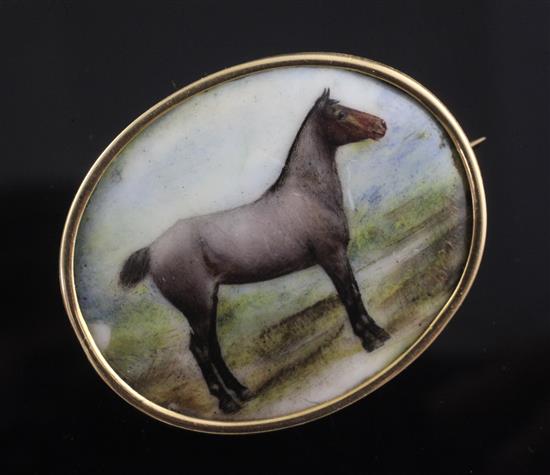 John William Bailey-(active 1860-1910) a gold mounted enamel brooch inset with a portrait of a horse Balsam 42mm.
